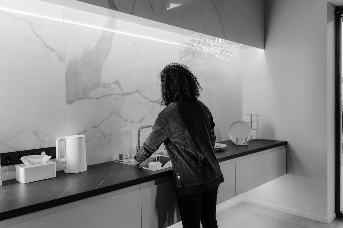 A kitchen countertop with a slim task light mounted under the wall cabinet